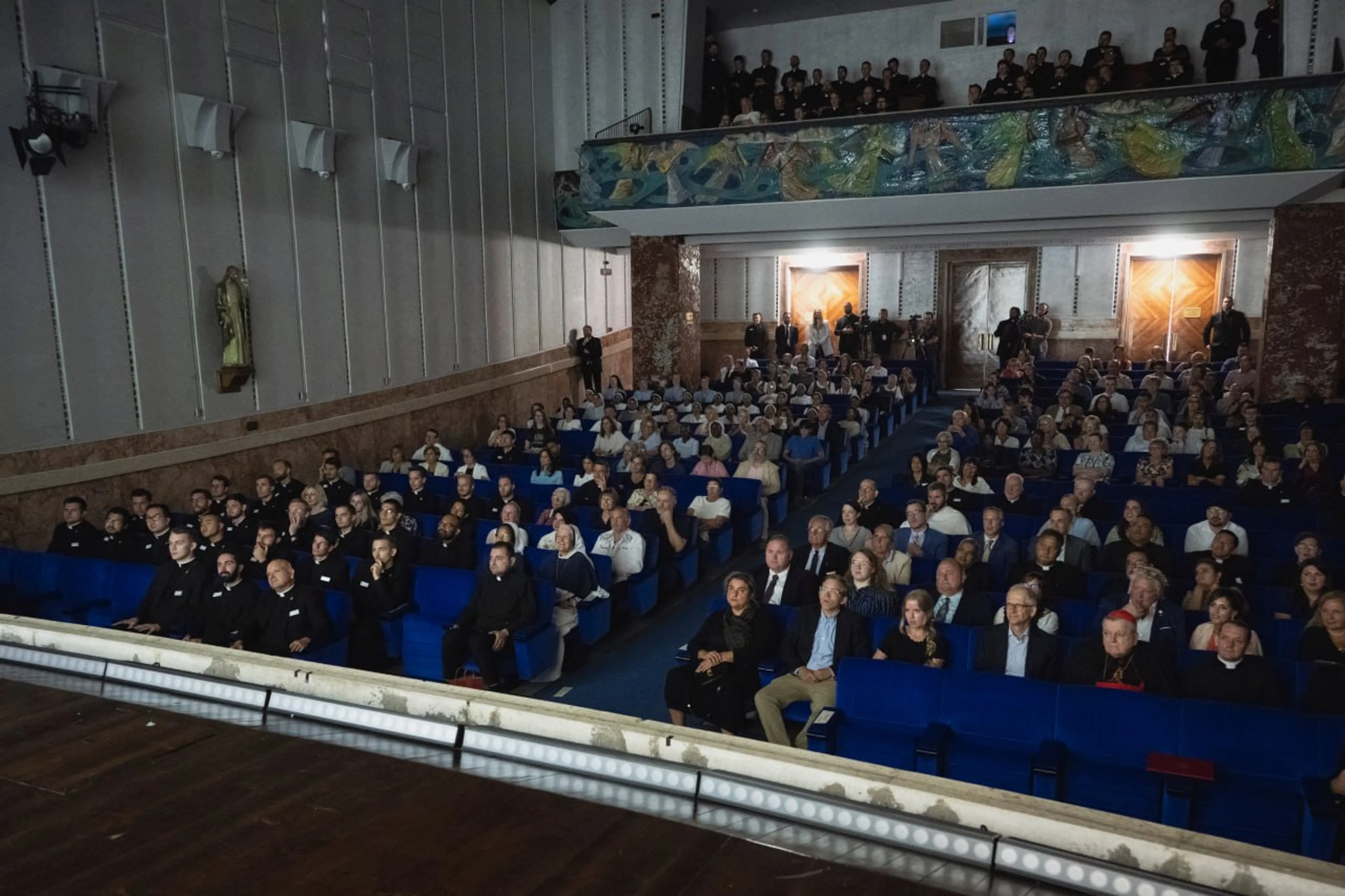 Packed film screening with clergy and community members